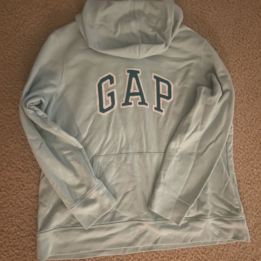This is a GAP sweatshirt that has been worn a couple of times. It’s light blue